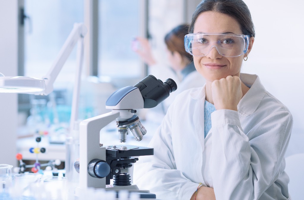 Clinical researcher in laboratory reviewing peptide research